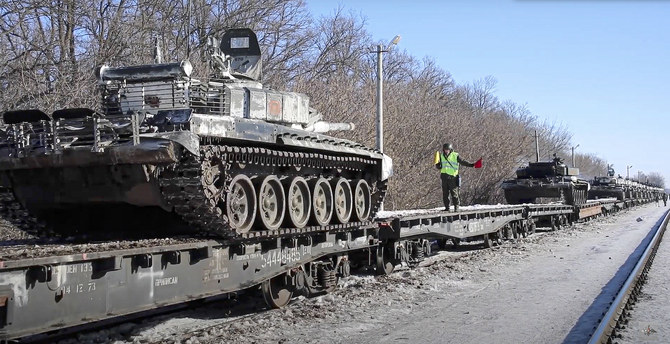 Russian army tanks are loaded onto railway platforms to move back to their permanent base after drills in Russia. (AP)