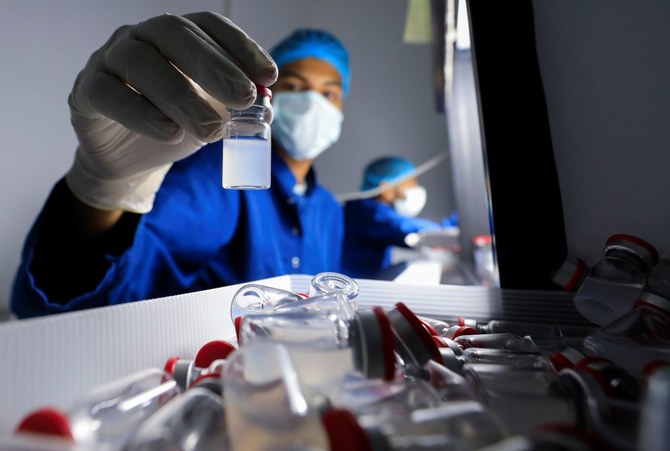 A lab technician holds a vial of China’s Sinovac COVID-19 vaccine in the visual inspection unit of the Holding Company for Biological Products and Vaccines (Vacsera), Cairo, Egypt, Aug. 31, 2021. (Reuters)