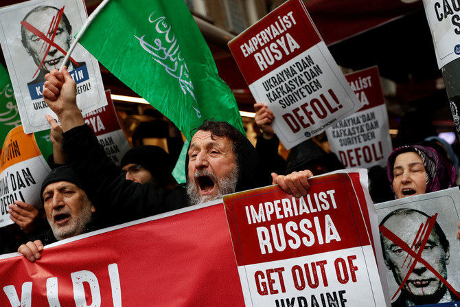 Demonstrators shout slogans during a protest against Russia’s military operation in Ukraine, in front of the Russian Consulate in Istanbul, Turkey, Feb. 24, 2022. (Reuters)
