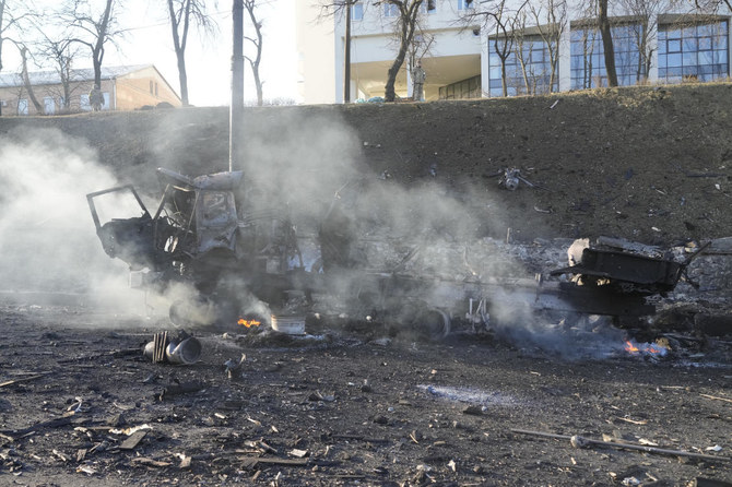 Debris of a burning military truck is seen on a street in Kyiv, Ukraine, Saturday, Feb. 26, 2022. (AP)