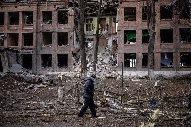 A man walks in front of a destroyed building after a Russian missile attack in the town of Vasylkiv, near Kyiv, on February 27, 2022. (AFP)