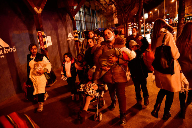 Ukrainian refugees fleeing from a Russian invasion stand at Nyugati station in Budapest, Hungary, on Feb. 27, 2022. (REUTERS/Marton Monus)