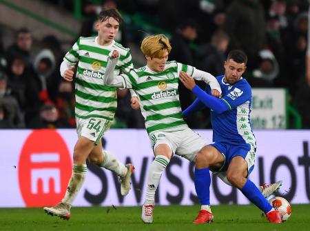 In this file photo taken on December 09, 2021 Celtic's Japanese striker Kyogo Furuhashi (centre) vies with Real Betis' Spanish striker Aitor Ruibal (right) during the UEFA Europa League group G football match at Celtic Park stadium in Glasgow, Scotland. (AFP/file)