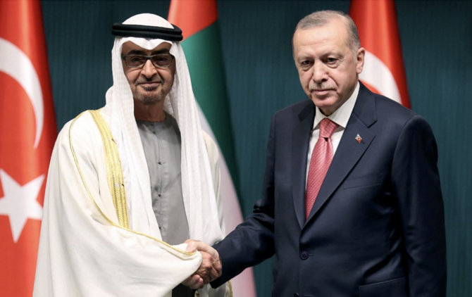 Turkish President Recep Tayyip Erdogan shakes hands with Abu Dhabi's Crown Prince Sheikh Mohammed bin Zayed Al-Nahyan during his visit to Turkey. (File/AFP)