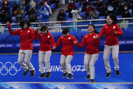 Silver medalists team Japan celebrates during a medal ceremony for the women's curling at the Beijing Winter Olympics Sunday, Feb. 20, 2022, in Beijing. (AP)