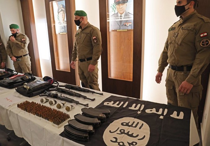 ISF show weapons the ministry of interior said were seized from the Daesh group which was planning attacks on targets in Beirut's southern suburbs, during a press conference in the Lebanese capital on February 23, 2022. (AFP)