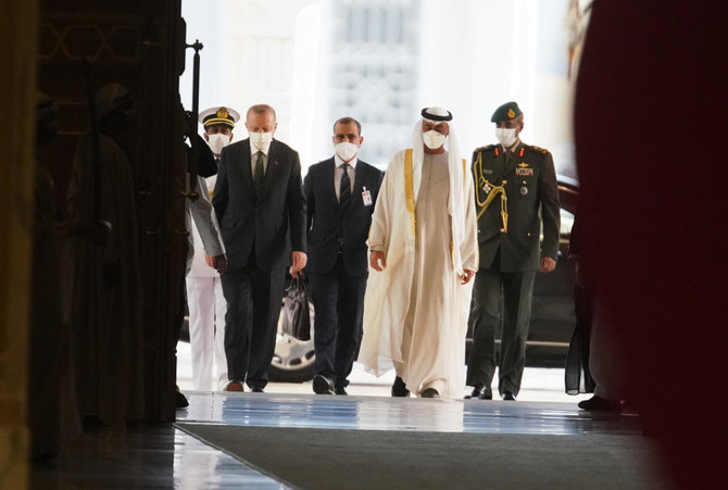 Turkish President Recep Tayyip Erdogan, left, and Abu Dhabi Crown Prince Sheikh Mohammed bin Zayed Al-Nahyan look over an honor guard at Qasr Al-Watan in Abu Dhabi, United Arab Emirates, Monday, Feb. 14, 2022. (AP)