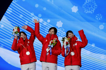 Silver medallists Miho Takagi, Ayano Sato and Nana Takagi of Japan celebrate on the podium. (Reuters)