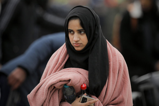 A student that fled the conflict from Ukraine awaits transportation, at the Romanian-Ukrainian border, in Siret, Romania, Sunday, Feb. 27, 2022. (AP)