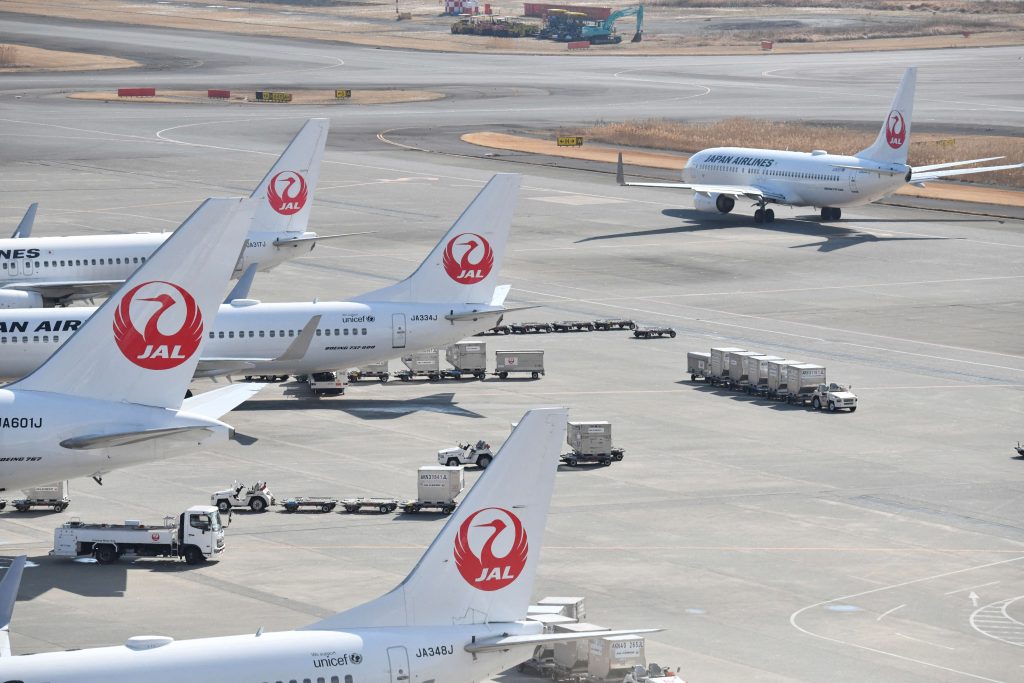 The airlines, which normally use Russian airspace for their Europe flights, join a growing number of carriers that have cancelled or rerouted flights between Europe and north Asia in the wake of the crisis. (AFP)