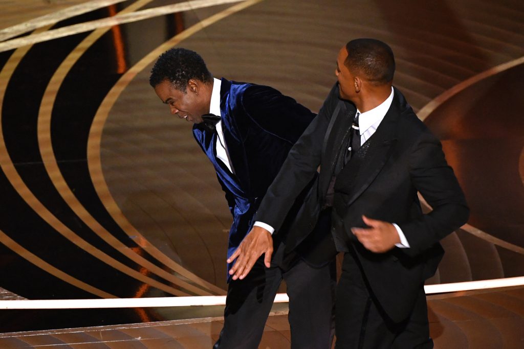 US actor Will Smith (R) slaps US actor Chris Rock onstage during the 94th Oscars at the Dolby Theatre in Hollywood, California on March 27, 2022. (AFP)