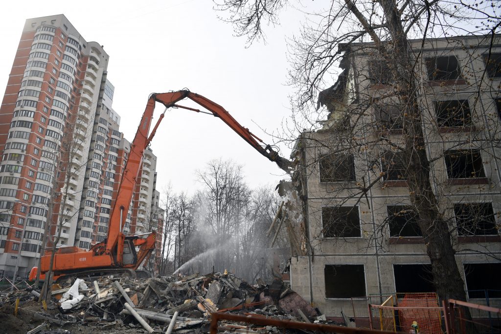 A Hitachi excavator demolishing a five-storey apartment block in Moscow. (AFP)