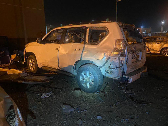 Falling debris from an intercepted missile damaged some vehicles at a parking lot in Jazan on Saturday. (SPA)