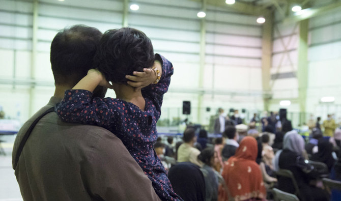 People who fled Afghanistan waiting for another flight at the air base of Al Dhafra, near Abu Dhabi as part of the operation 