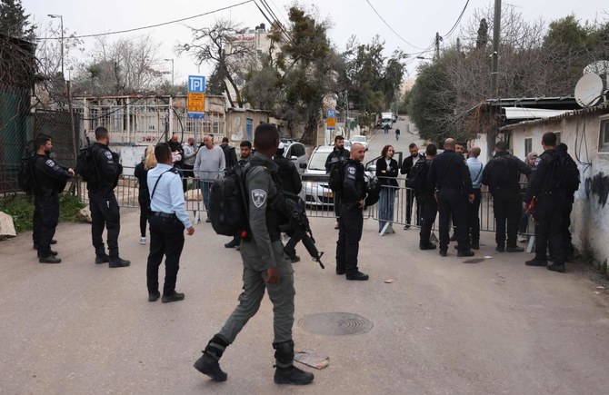 An Israeli checkpoints bars the entrance to Sheikh Jarrah, a day after the Supreme Court froze the eviction of four Palestinian families from the flashpoint east Jerusalem neighborhood, on March 2, 2022. (AP)