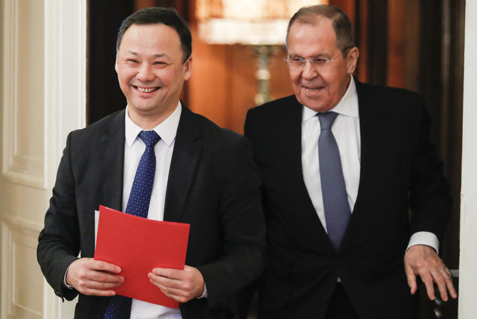 Russian Foreign Minister Sergey Lavrov, right, and Kyrgyzstan Foreign Minister Ruslan Kazakbayev before talks in Moscow, Russia, Saturday, March 5, 2022. (AP Photo)