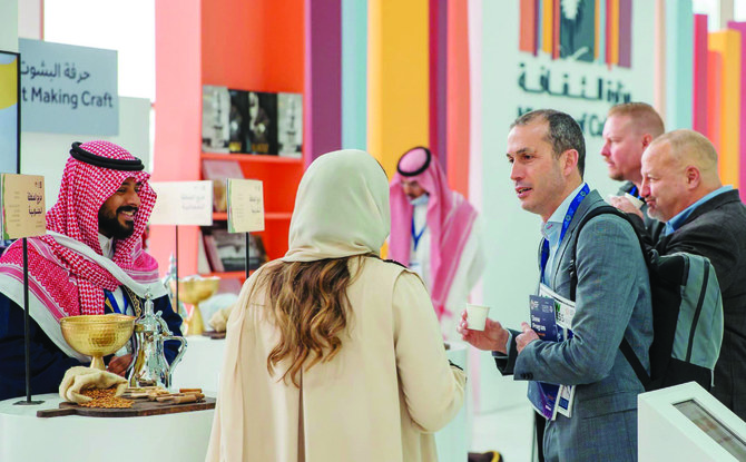 The guests at the World Defense Show being received with a beautiful range of Saudi coffees, as well as a review of how they are made. (SPA)