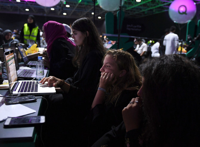 Participants including Saudi women attend a hackathon in Jeddah on August 1, 2018. (AFP)