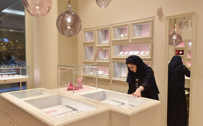 Saudi Rodina Maamoun, who employed 19 young women almost entirely replacing the men, sells jewellery at a retail store in Riyadh's Hayat mall on February 19, 2020. (AFP)