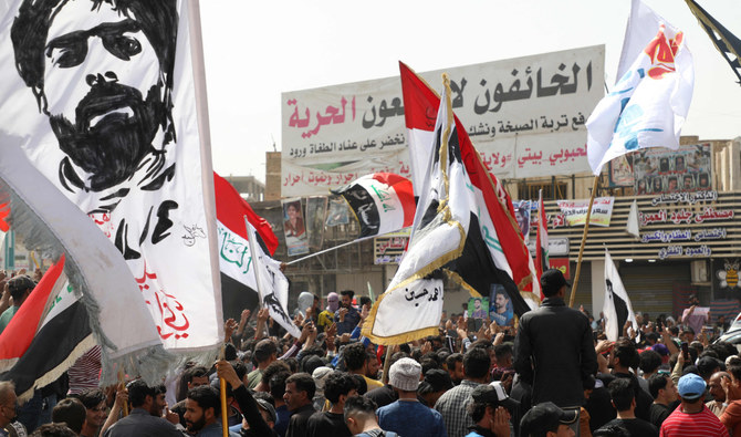 Iraqis demonstrate to denounce rising prices of basic food items in the center of Iraq’s city of Nasiriyah in the southern Dhi Qar province on Wednesday. (AFP)