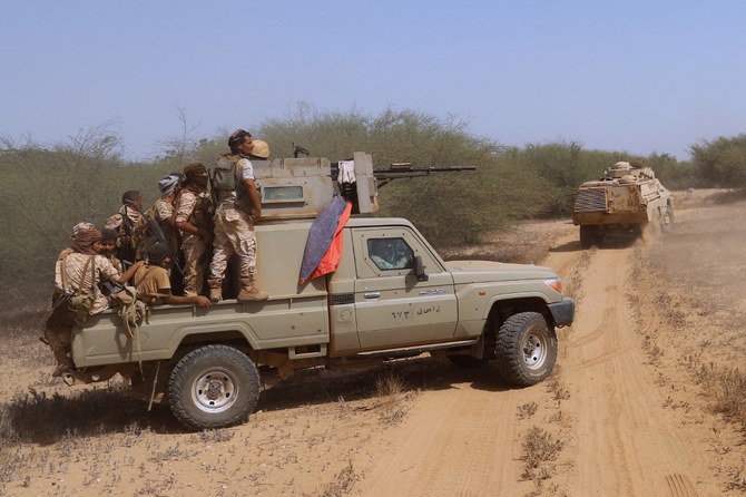 Yemeni pro-government fighters man a position near a camp during fighting to drive the Houthis from Haradh, in Yemen's Hajjah province. (File/AFP)