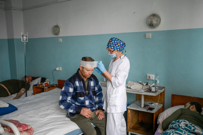 A Ukrainian man injured during Russian attack receives treatment in the central hospital of Mykolaiv, 100 km away from Odessa, western Ukraine on March 8, 2022. (Videograb from police handout/AFP)