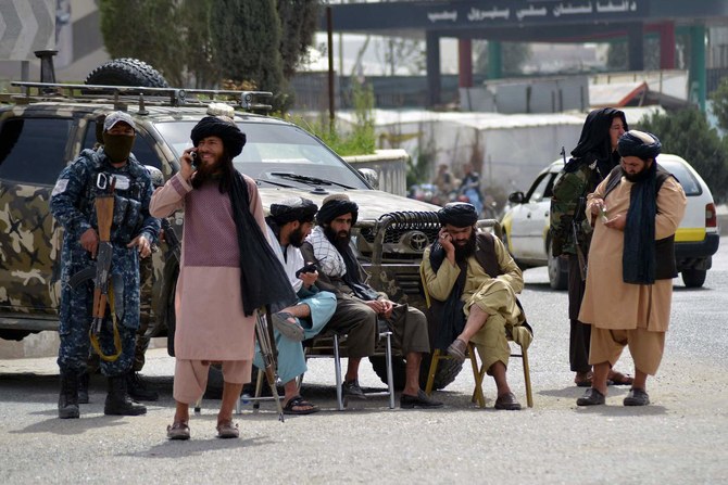 Members of the Taliban man a road checkpoint in Kandahar on March 15, 2022. (AFP)