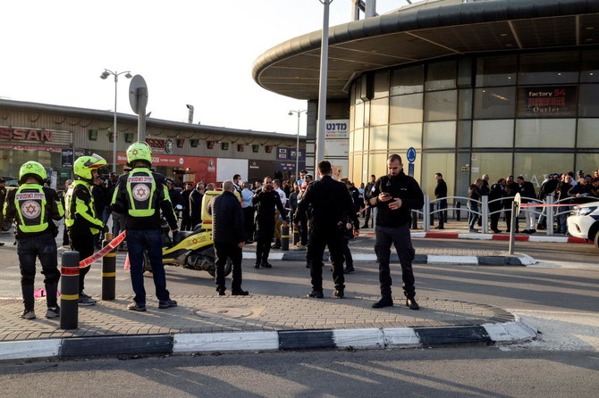 Israeli security and rescue forces secure the scene of an attack in which people were killed near a shopping center in Beersheba, Israel, March 22, 2022. (Reuters)