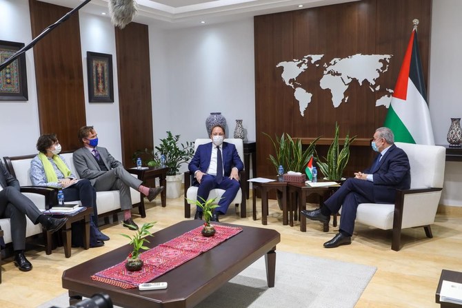 EU Commissioner Oliver Varhelyi and Palestinian Prime Minister Mohammed Shtayyieh, Ramallah, Mar. 24, 2022. (Twitter Photo)