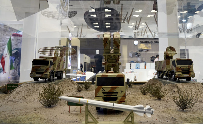 Models of Iranian missiles are seen at a stand at the DIMDEX exhibition in Doha, Qatar, on March 23, 2022. (AP Photo/Lujain Jo)