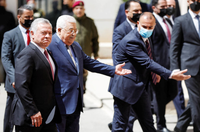 Jordanian King Abdullah is welcomed as he arrives to meet Palestinian President Mahmoud Abbas in Ramallah, in the Israeli-occupied West Bank March 28, 2022. (REUTERS)