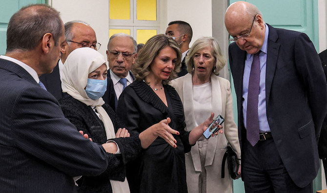 Listen as Maysoun Chehab (C), UNESCO's National Education Professional Officer for Lebanon, during a ceremony marking the completion of a project to rehabilitate 280 educational buildings damaged by the 2020 Beirut port blast. (AFP)