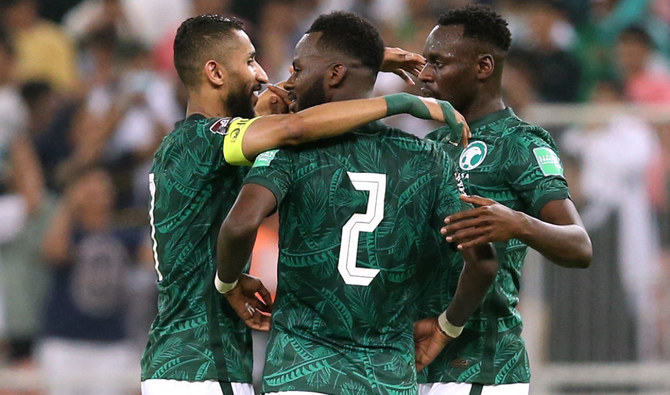 Saudi Arabia's Hassan Al Tambakti celebrates with teammates after the match. (Reuters)