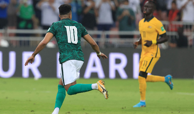 Saudi Arabia's midfielder Salem Al-Dawsari celebrates after scoring the opening goal. (AFP)