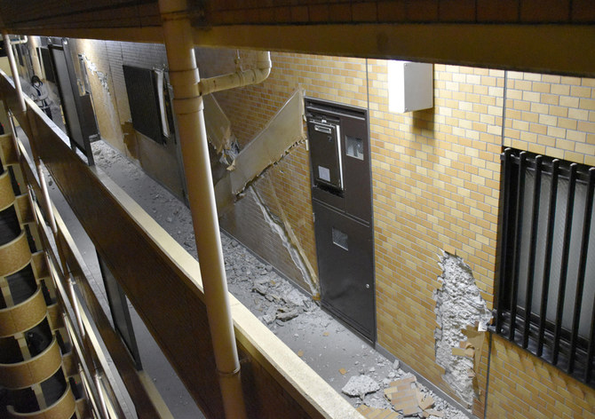 Broken masonry at an apartment block in Fukushima, northern Japan, Thursday, March 17, 2022, following an earthquake. (AP Photo)