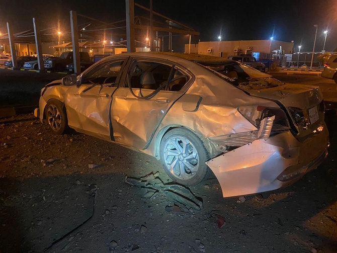 Saudi firefighters inspect the damage caused by the debris of a missile intercepted in Jazan on Saturday night. (SPA)