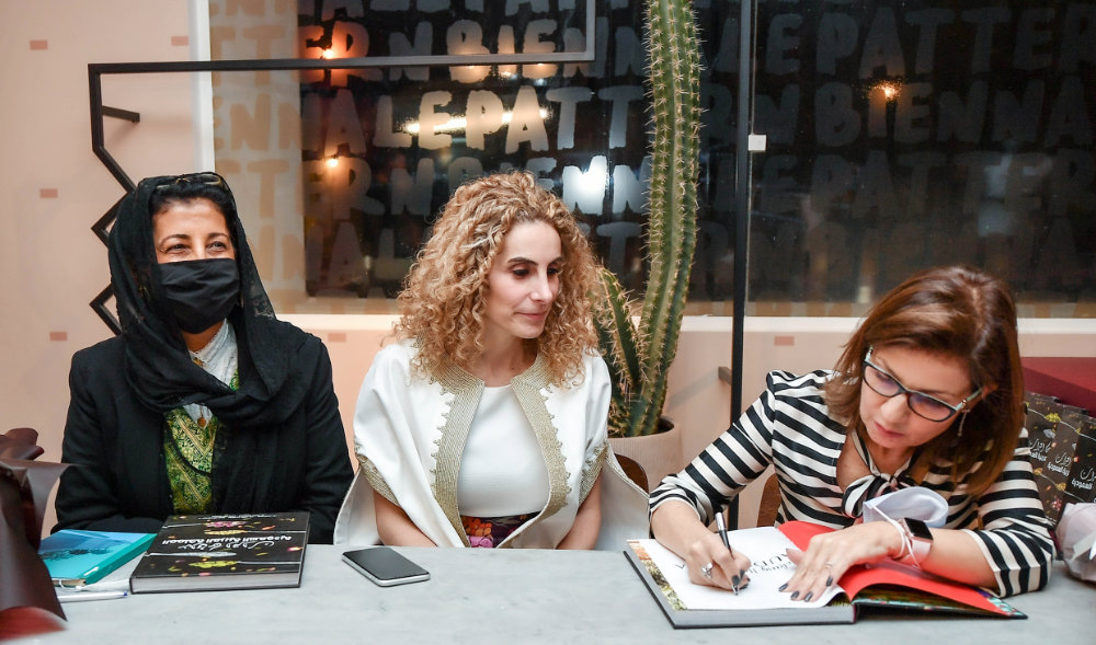 (From left) Dr. Awatif Alkeneibit, Jacqueline Jackaman and Sahar Jamal during the signing of the book Wednesday at the Diriyah Biennial on Wednesday. (AN Photo/Basheer Saleh)