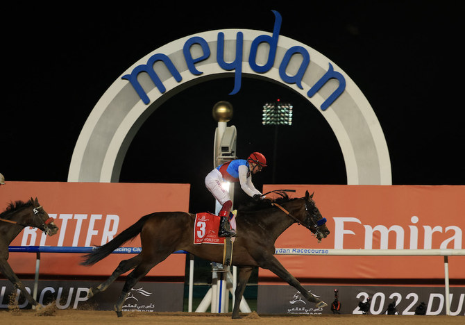 Country Grammer ridden by Frankie Dettori wins the Dubai World Cup. (Reuters)