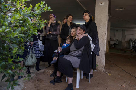 Mourners attend the funeral of Avishai Yehezkel, 29, in Bnei Brak Israel, Wednesday, March 30, 2022. Yehezkel was killed by a gunman in a crowded city in central Israel late Tuesday. (AP)