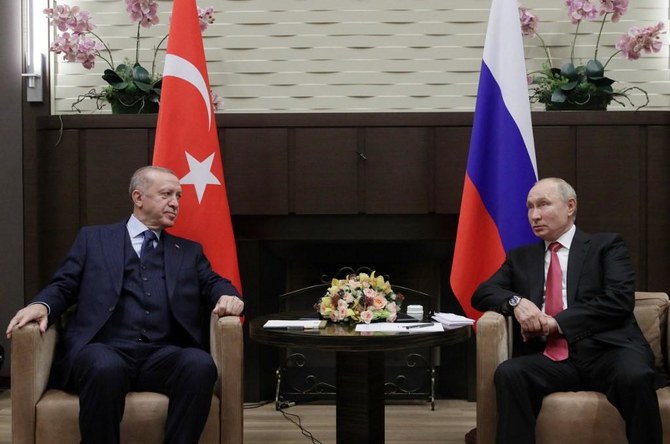 Russian President Vladimir Putin, right, meets with his Turkish counterpart Recep Tayyip Erdogan in Sochi on September 29, 2021. (AFP)
