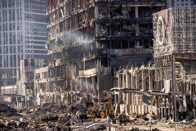 Ukrainian firefighters work amid the rubble of the Retroville shopping mall, a day after it was shelled by Russian forces in the Ukranian capital Kyiv. (AFP)