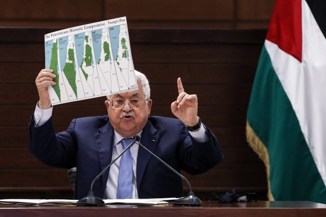 PA President Mahmoud Abbas displays a map of historic Palestine and Palestinian land loss since 1937 in Ramallah, West Bank, Sept. 3, 2020. (AFP)