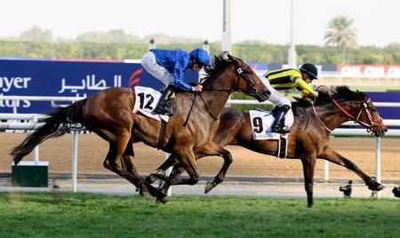 Jockey Christophe Lemaire (right) on Stay Foolish (Japan) takes part in the Dubai World Cup horse racing event at the Meydan racecourse, on March 26, 2021. (AFP)