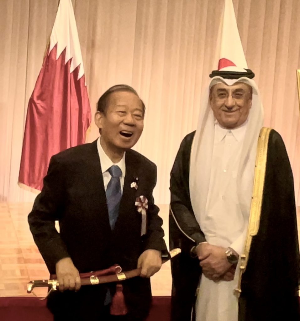 Ruling Liberal Democratic Party’ strong man Nikai shares a smile with Ambassador Al-Emadi after receiving an Arabic sword gift. (ANJ)