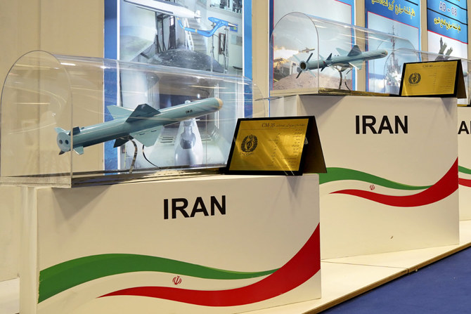 Models of Iranian missiles are seen at a stand at the DIMDEX exhibition in Doha, Qatar, on March 23, 2022. (AP Photo/Lujain Jo)