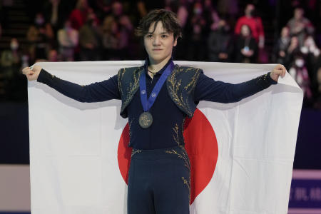 Shoma Uno of Japan celebrates his gold medal during the men's victory ceremony at the Figure Skating World Championships in Montpellier, south of France, Saturday, March 26, 2022. (AP)