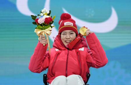Gold medallist Momoka Muraoka of Japan celebrates on the podium during the medal ceremony. (Reuters)