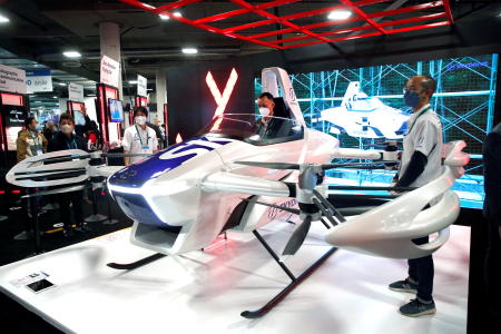 An attendee checks out a zero-emissions SkyDrive flying car during CES 2022 in Las Vegas, Nevada, US on January 6, 2022. (Reuters)