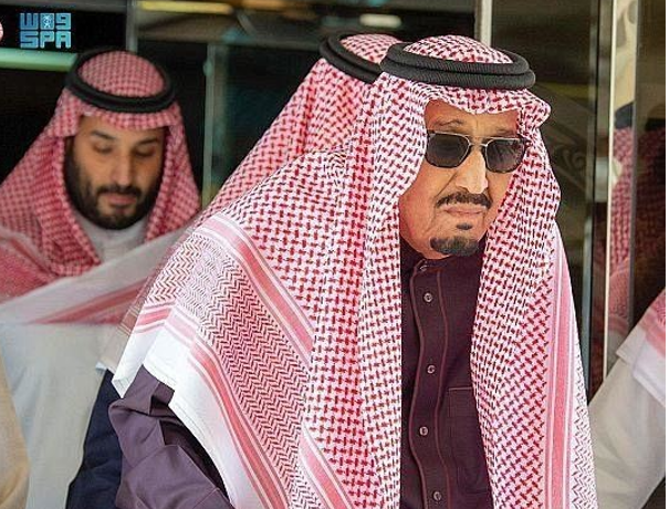 State television aired a video clip of the 86-year-old monarch walking using a cane with his son Crown Prince Mohammed bin Salman, the kingdom's de facto ruler, close by. (SPA)