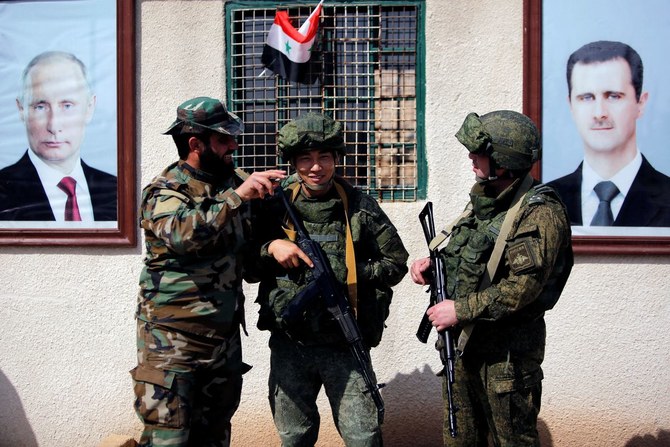 Syrian and Russian soldiers at a checkpoint near Wafideen camp in Damascus, Syria, Mar. 2, 2018. (Reuters)